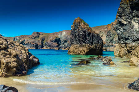 Amazing Kynance Cove beach with crystal clear water in Cornwall, England