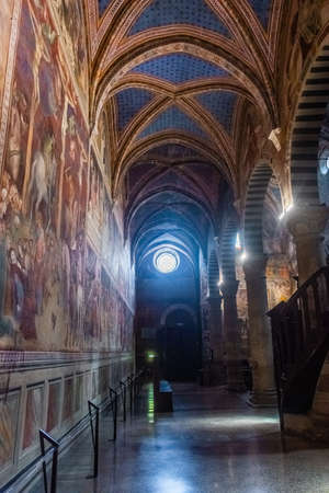 San Gimignano, Italy, 15 April 2022: Beautiful frescoes in the medieval cathedralのeditorial素材