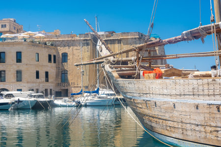 Birgu, Malta, 22 May 2022: Ancient wooden ship in the harbor of Birguのeditorial素材