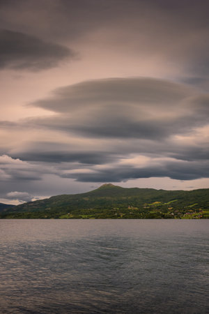 Majestic lenticular cloud over a fjord in Norwayの写真素材