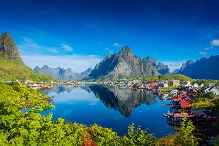 Perfect reflection of the Reine village on the water of the fjord in the Lofoten Islands, Norwayのeditorial素材
