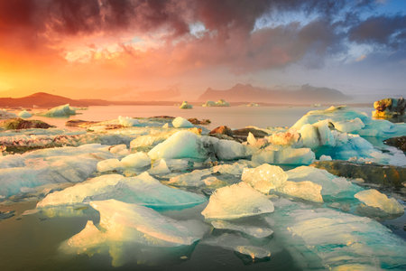 Amazing sunset over the icebergs of the Jokulsarlon Glacier Lagoon, Icelandの写真素材