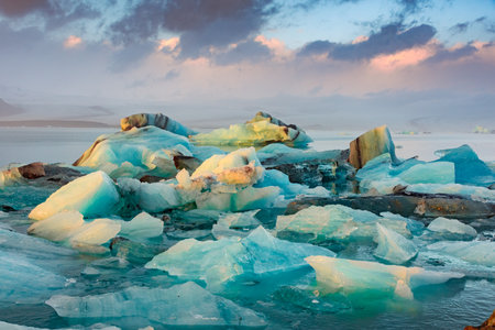 Amazing sunset over the icebergs of the Jokulsarlon Glacier Lagoon, Icelandの写真素材