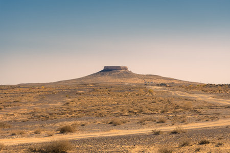 The fortress of Chilpik Kala, a tower of silence (dakhla) of the ancient Zoroastrian religion, serving as burial site in the desert, Uzbekistanの写真素材