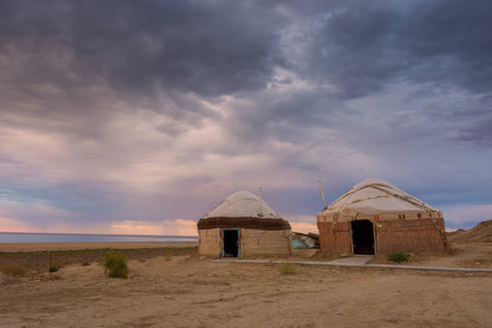 Nomadic Yurt tent camp in the desert of the Aral Lake at sunset, Uzbekistanの写真素材