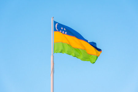 Waving flag of Karakalpakstan Republic, in Nukus, capital city of Karakalpakstanの写真素材