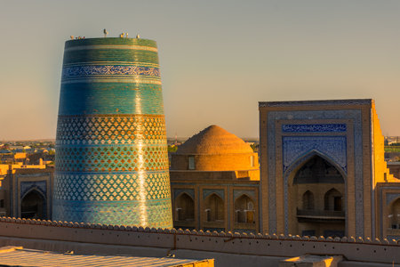 Beautiful sunset over the Itchan Kala of Khiva ancient historic center, Uzbekistanの写真素材