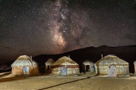 Amazing milky way and starry night over a yurt camp in the Aral Lake desert, Uzbekistan