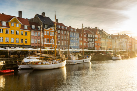 Copenhagen, Denmark, 22 September 2024: Nyhavn Canal at sunrise with colorful housesの写真素材