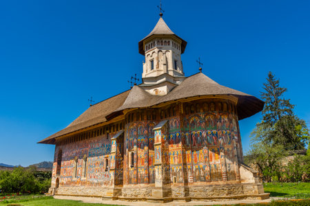 Amazing colorful painted monastery of Moldovita, Bucovina, Romaniaの写真素材