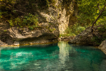 Crystal clear waters of natural springs and lake in the woods of the Mount Olympus, Greeceの写真素材