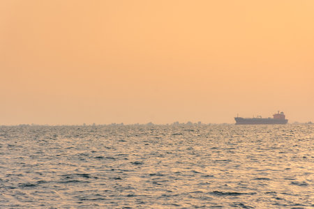 Ship in the horizon at sunset, Thessaloniki, Greeceの写真素材