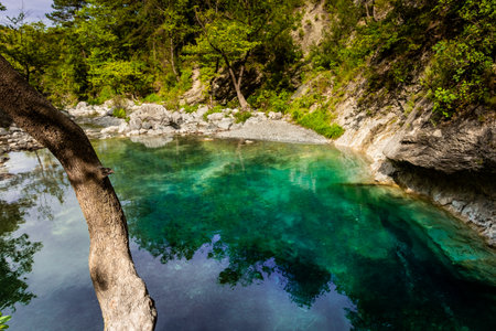 Crystal clear waters of natural springs and lake in the woods of the Mount Olympus, Greeceの写真素材