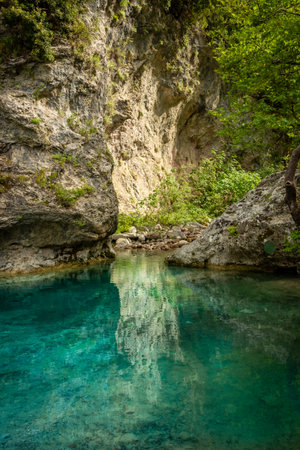 Crystal clear waters of natural springs and lake in the woods of the Mount Olympus, Greeceの写真素材