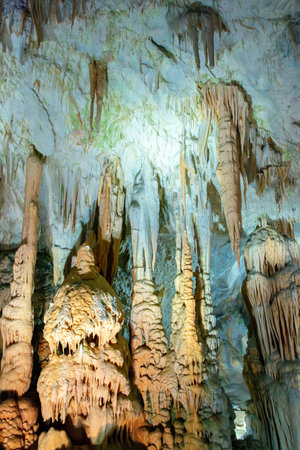 Exploring beautiful Postojna cave in Slovenia the most visited European cave. Thousands of stalagmites and stalactitesの写真素材