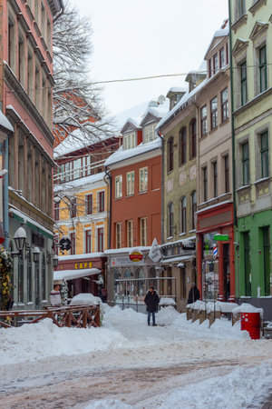 Riga, Latvia, 2 December 2023: Snowy streets of Riga historic center in winterの写真素材