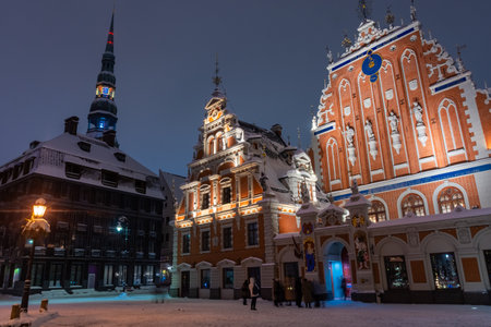 Snowy square of Riga historic center at night, Latviaの写真素材