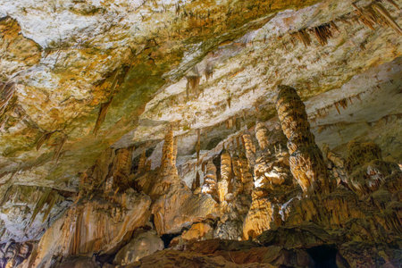 Exploring beautiful Postojna cave in Slovenia the most visited European cave. Thousands of stalagmites and stalactitesの写真素材