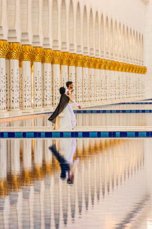 Abu Dhabi, UAE, 9 August 2023: Reflection in the beautiful Sheikh Zayed Grand Mosque at sunsetの写真素材