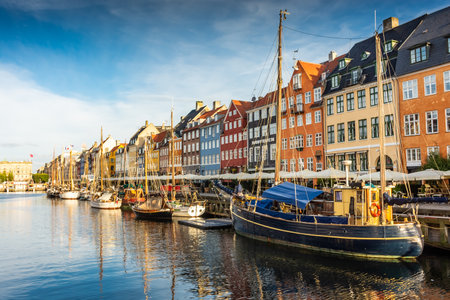 Copenhagen, Denmark, 22 September 2024: Nyhavn Canal at sunrise with colorful housesの写真素材