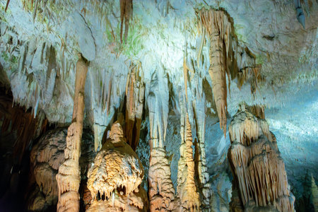 Exploring beautiful Postojna cave in Slovenia the most visited European cave. Thousands of stalagmites and stalactitesの写真素材