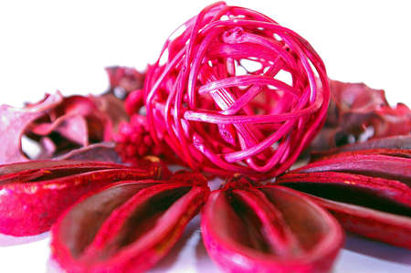 Ratan ball sitting on dried nutshellsの写真素材