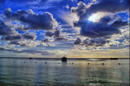 HDR rendered image of boat in lagoon at sunset