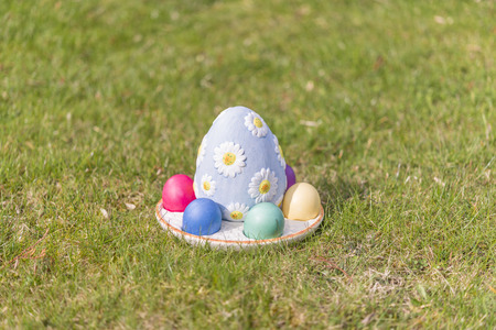 Colorful easter eggs on green grassの写真素材