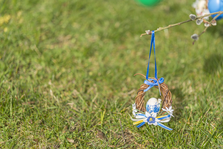 Blue easter crest with green grass in the backgroundの写真素材