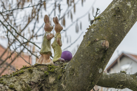 Colorful easter eggs and easter bunny on a treeの写真素材