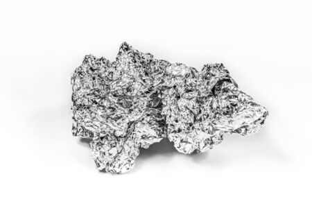 Crumpled aluminum foil on white background