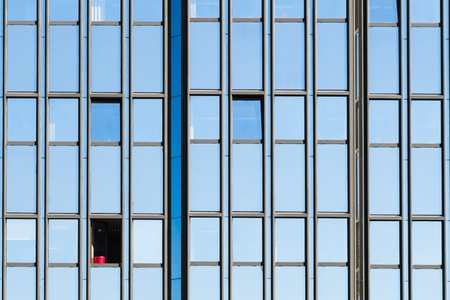 Red jar in a open window of a office building