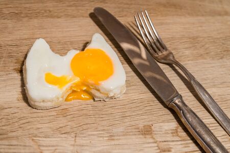 Fried egg in the shape of the Holsten Gate in Lubeck with toast breadの写真素材