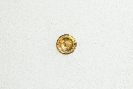 Old vintage door bell with stone backgroundの写真素材