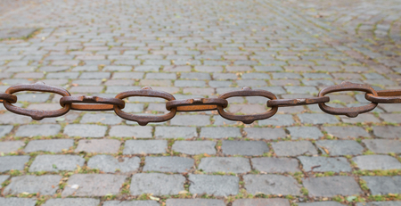 Rusty chain cobblestones in the background