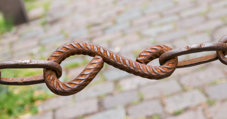 Rusty chain cobblestones in the backgroundの写真素材