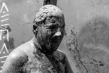 Germany, Luebeck, June 19, 2017, Bronze statue with the name, revolving door, in the pedestrian zone in Luebeckのeditorial素材