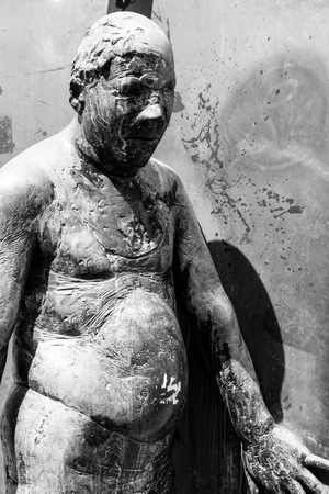 Germany, Luebeck, June 19, 2017, Bronze statue with the name, revolving door, in the pedestrian zone in Luebeckのeditorial素材
