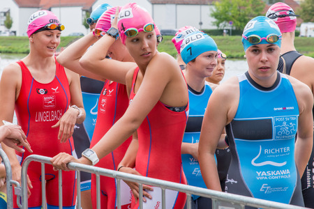 Regensburg, Bavaria, Germany, August 06, 2017, 28th Regensburg Triathlon 2017, female swimmer preparing for the startのeditorial素材