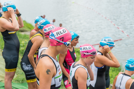 Regensburg, Bavaria, Germany, August 06, 2017, 28th Regensburg Triathlon 2017, female swimmer preparing for the startのeditorial素材