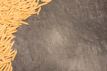Penne Rigate macaroni pasta on white background