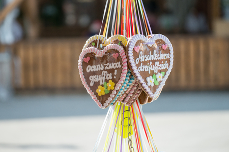 Gingerbread heart at a folk festival with german wordsの写真素材