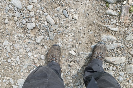 Hiking boots on a stony hiking trail