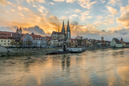 Regensburg in the evening light with the Cathedral and the stone bridge, Germany