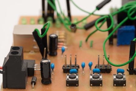 Closeup of a self-made printed circuit board with microcontroller