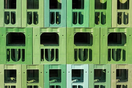 Many green stacked plastic beverage cratesの写真素材