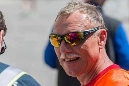Regensburg, Bavaria, Germany, May 13, 2018: Track Marshal of the Regensburg Marathon 2018 at the Old...