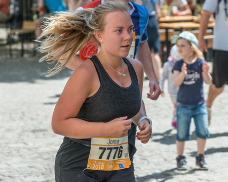 Regensburg, Bavaria, Germany, May 13, 2018: Participant of the Regensburg Marathon 2018 at the old city hallのeditorial素材