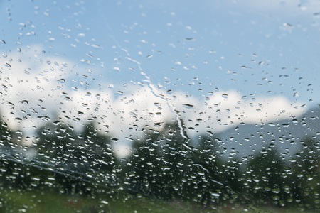 Raindrops on a car windshield