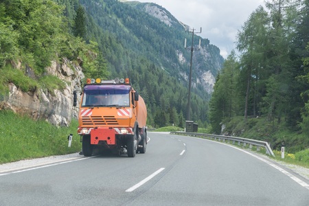 Road sweeper on a road, Austria
